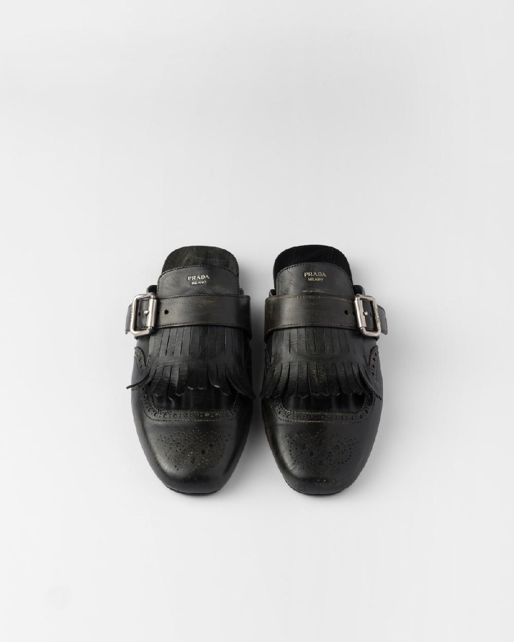 Prada Mules Shuffle de piel con flecos Ventas relámpago