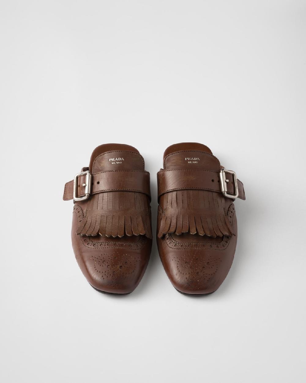Prada Mules Shuffle de piel con flecos Descuento