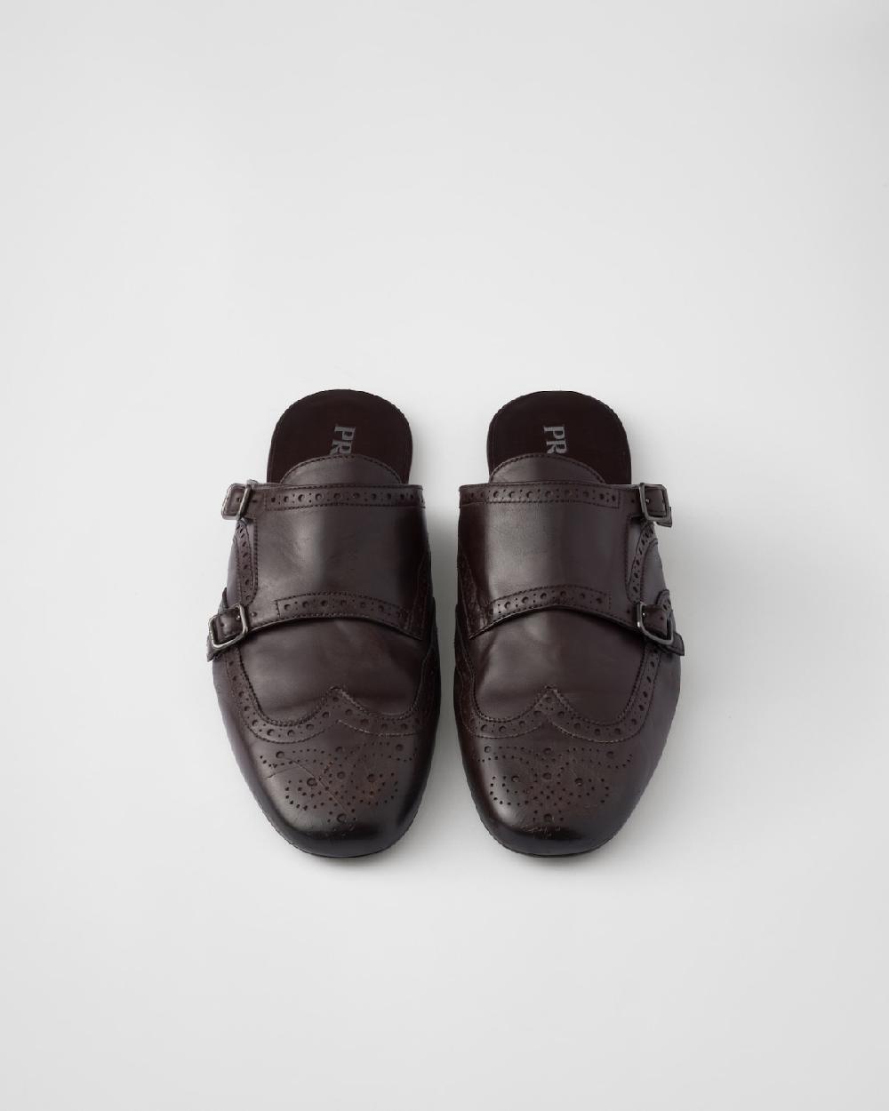 Prada Mules Shuffle de piel con doble tira de hebilla Descuento por venta flash