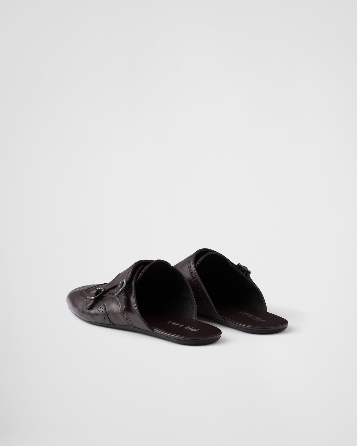 Prada Mules Shuffle de piel con doble tira de hebilla Descuento por venta flash