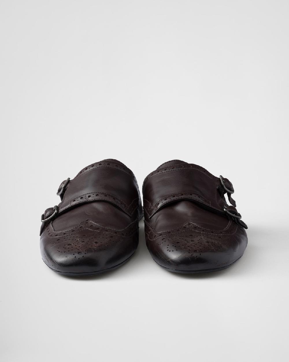 Prada Mules Shuffle de piel con doble tira de hebilla Descuento por venta flash