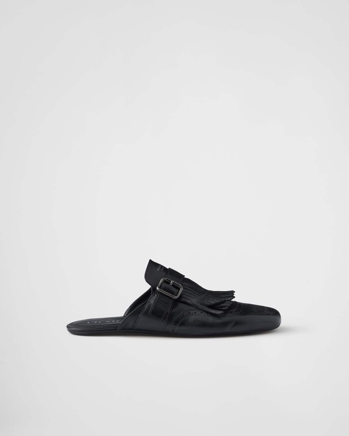 Prada Mules Shuffle de piel con flecos y correa de hebilla Ofertas especiales