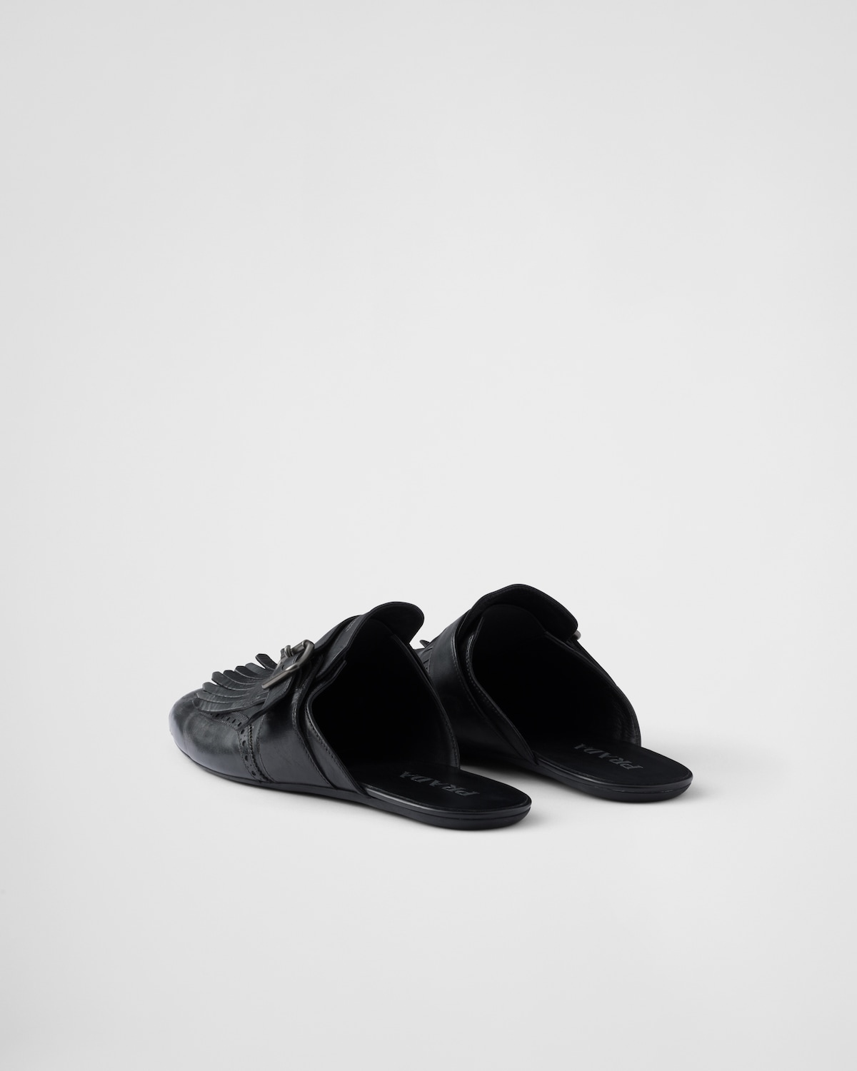 Prada Mules Shuffle de piel con flecos y correa de hebilla Ofertas especiales
