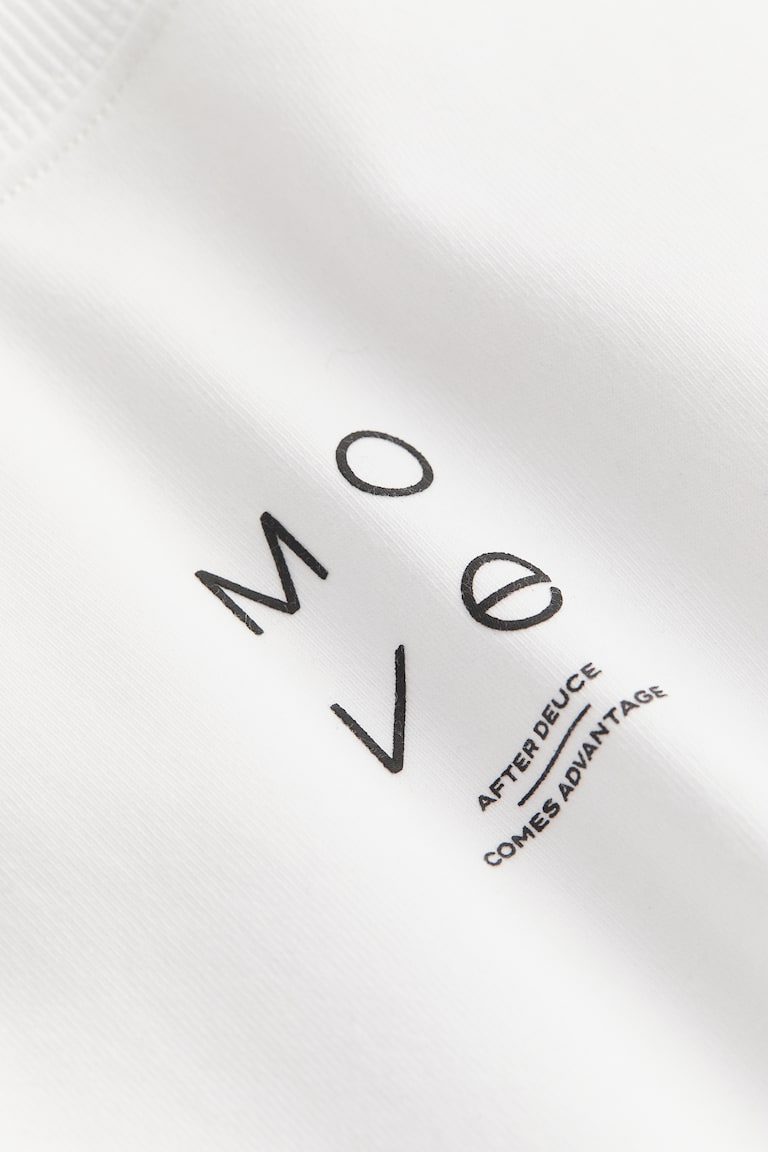 H&M Camiseta de deporte con DryMove™ - Gris claro jaspeado - MUJER Los más vendidos