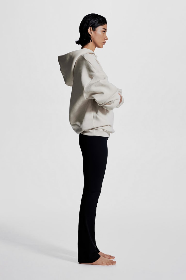 H&M Leggings de yoga acampanados con SoftMove™ Lycra® - Marrón oscuro - MUJER