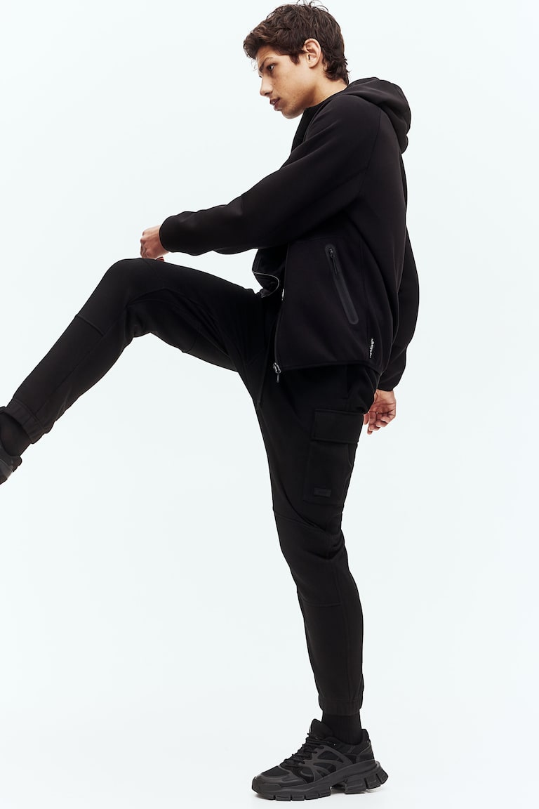 H&M Joggers cargo de algodón con DryMove™ Regular Fit - Negro - HOMBRE Rebajas de fin de temporada