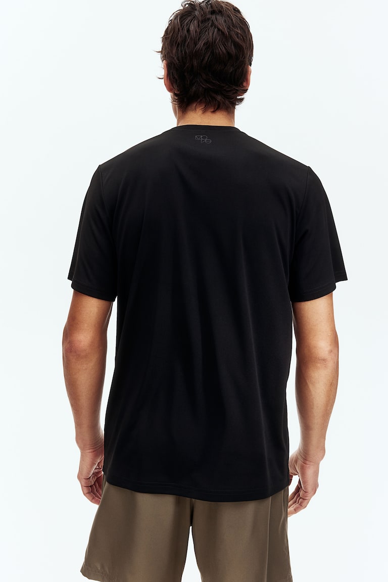 H&M Camiseta de deporte con DryMove™ Regular Fit - Blanco - HOMBRE Rebajas