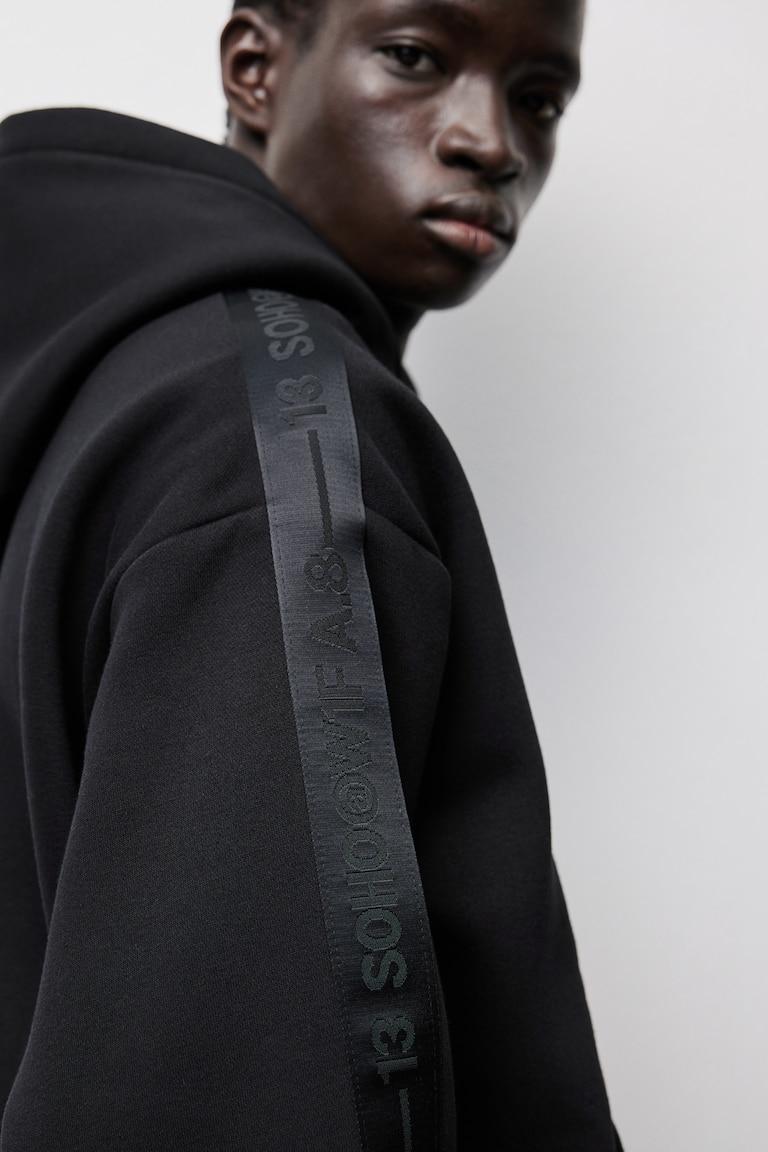 H&M Sudadera con capucha y franjas laterales Loose Fit - Gris oscuro - HOMBRE Tienda
