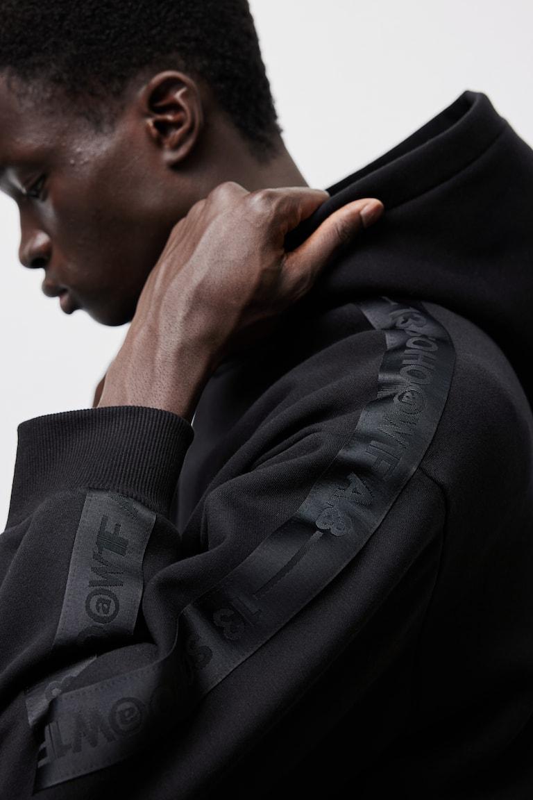 H&M Sudadera con capucha y franjas laterales Loose Fit - Gris oscuro - HOMBRE Tienda