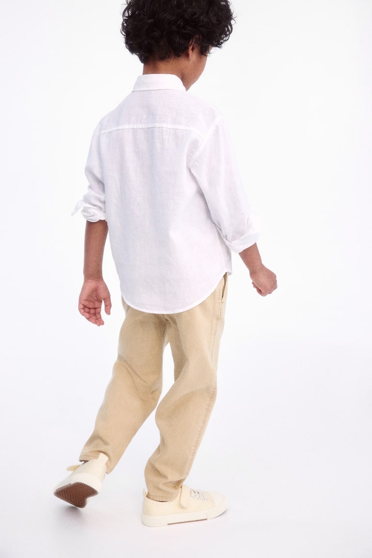 H&M Chinos pitillo de corte holgado en sarga - Gris - NIÑOS Superdescuento